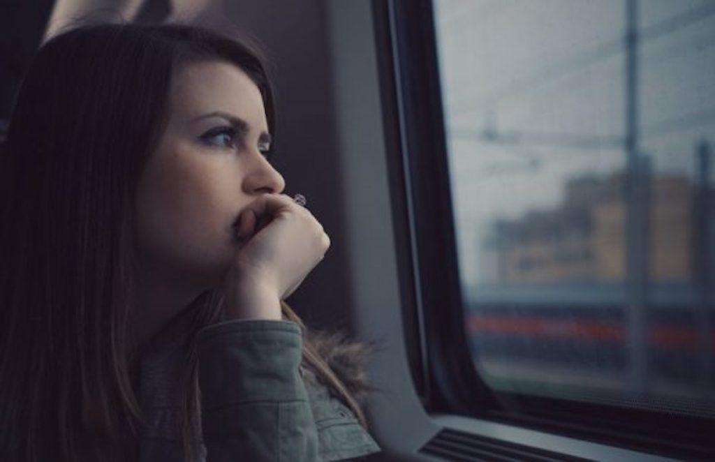 Worry Worrying Cornwall anxiety depression woman looking out window of train