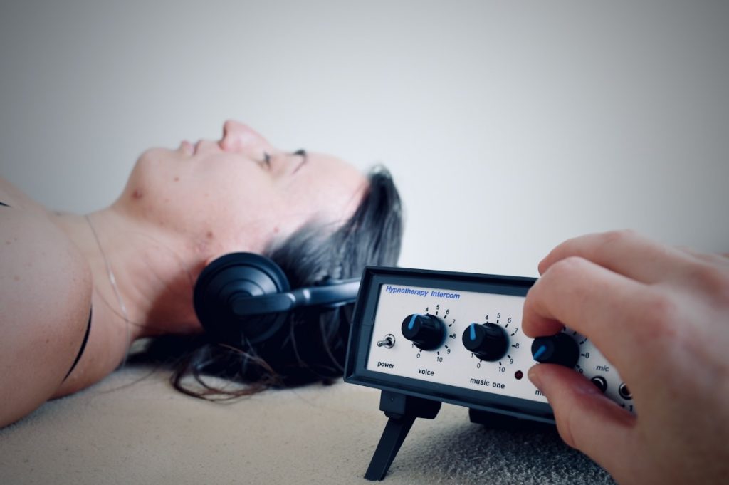 Neil Cox using the HypnoCom 5 communication system during a hypnotherapy session